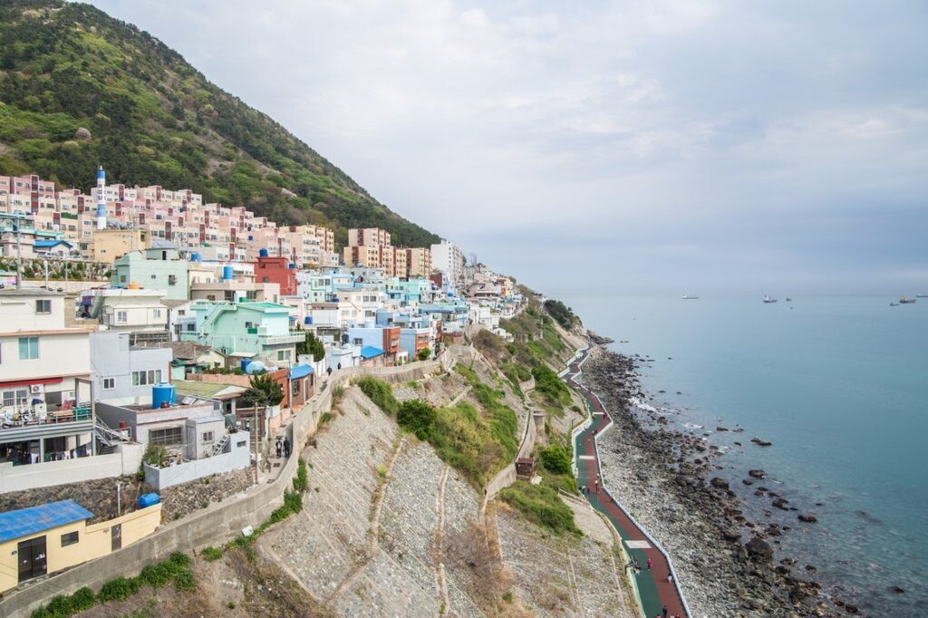 Huinnyeoul Culture Village along the coastal cliffs in Busan, South Korea, with colorful houses overlooking the sea